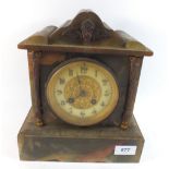 A 19th century French green marble mantel clock with striking movement, 25cm tall