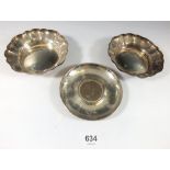 A pair of silver pin dishes and a silver dish inset Churchill crown, 231g