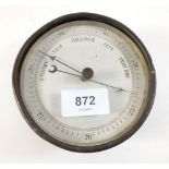 A brass marine barometer - 12cm diameter