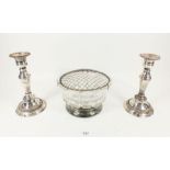 A cut glass and silver plated rose bowl and two Sheffiled silver plated candle sticks