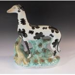 A 19thC Staffordshire figure of a dog, possibly a Dalmation