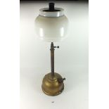 A vintage Tilley table lamp with glass shade
