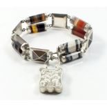 A silver Scottish agate bracelet with pairs of cylindrical links and square links and an engraved