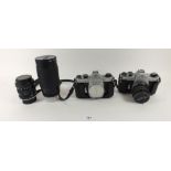 Two Pentax cameras and two Tamron lenses: 35-210mm and 28-70mm