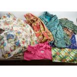A box of vintage clothes, vintage curtains and fabrics