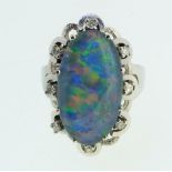 A 14 carat white gold ring set oval opal triplet within white stone surround, size P/Q