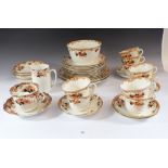 A Gladstone China tea service comprising: nine cups and saucers, twelve tea plates, two cake plates,