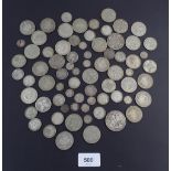 A quantity of British silver content coins including: threepences, shillings, halfcrowns, crowns