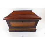 A 19thC sarcophagus form mahogany tea caddy inlaid with rosewood and satinwood, 30cm wide