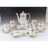 A Royal Standard 'Rambling Rose' coffee service consisting six trios, coffee pot, sugar and milk