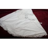 A group of lace edged table linen