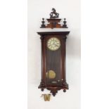 A 19th century Vienna style mahogany wall clock