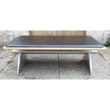 A late 20th century retro vintage airport bench with polished aluminium and steel legs, ply base and