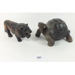 An oriental carved wooden tortoise 17cm and a carved wooden lion