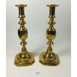 A pair of brass Queen's Diamond candlesticks