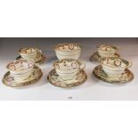 An Edwardian George Jones Crescent part tea service comprising: five cups and saucers (one