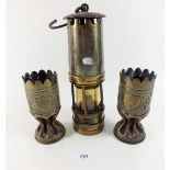 A brass mining lamp and two trench art brass vases