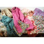 A box of vintage clothes, fabrics and curtains