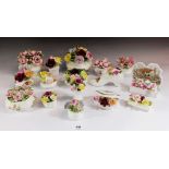 A collection of seventeen small porcelain 'rose basket' ornaments by Royal Albert, Royal Doulton,