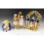 Two 19thC Staffordshire figures and a lidded toby jar