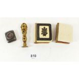 A gilt metal seal set paste gem stones and two ivorine clad miniature prayer books, one with biro