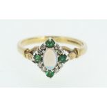 A 9ct gold ring set with central opal flanked by white and green stones, 3g, size O 1/2