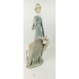 A large Lladro figure of a woman with deer, 45cm tall