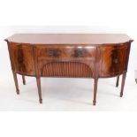 A good quality early 20th century reproduction mahogany sideboard with pair of curved cupboards