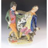 A 19thC Staffordshire figure group of two men brawling, 30.5cm