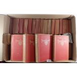 A set of forty volumes by Anatole France in red cloth covers