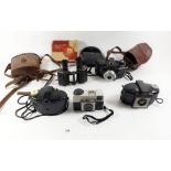 A selection of miscellaneous old cameras and an old electric shaver