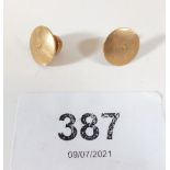 A pair of 18ct gold button studs, 2.5g