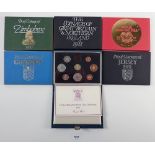 A quantity of six Royal Mint issue coin sets including: proof coinage of Zimbabwe 1980, Papua New