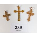 Three vintage 9 carat gold crucifix pendants, total weight 2.8g