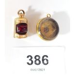 A 9 carat gold charm in the form of a ships lantern and an antique yellow metal pendant set with a