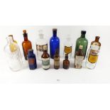 A collection of glass bottles including blue Poison bottle