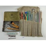 A quantity of vintage knitting needles and a set of rug making tools