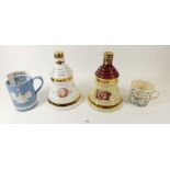 Two Bells whisky decanters - boxed, a Wedgwood Christmas tankard - boxed and a Speed the Plough mug