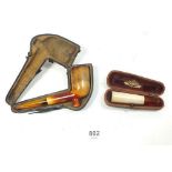 A Meerschaum and amber pipe, cased and a similar cigarette holder