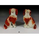 A pair of Staffordshire pottery Spaniel figures, 16cm