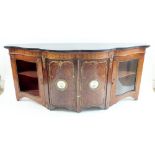 A Victorian rosewood and mahogany low credenza with marquetry frieze over a pair of serpentine