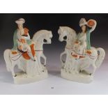 A pair of Staffordshire flat back figures of a Scottish laird and lady, 29cm