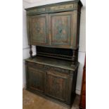 A 20th century green stained continental dresser, the back with a pair of carved doors raised on
