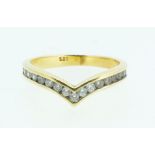 A 14 carat gold wishbone ring set white stones