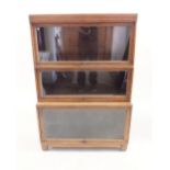 An oak three section Globe Wernicke style bookcase - 85cm wide x 126cm high x 34cm deep