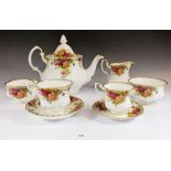 A Royal Albert Country Roses teaset comprising six tea cups and saucers, six coffee cups and