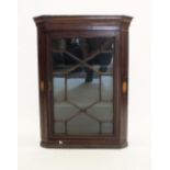 A mahogany small astragal glazed corner cupboard with shell inlay and banding