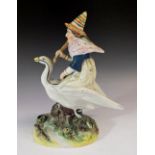 A 19thC Staffordshire pottery figure of Mother Goose, 18cm