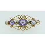 An Edwardian style 9 carat gold brooch set amethyst and seed pearls, 3g