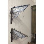 A pair of Edwardian cast iron brackets with reg no. 264391, size 4